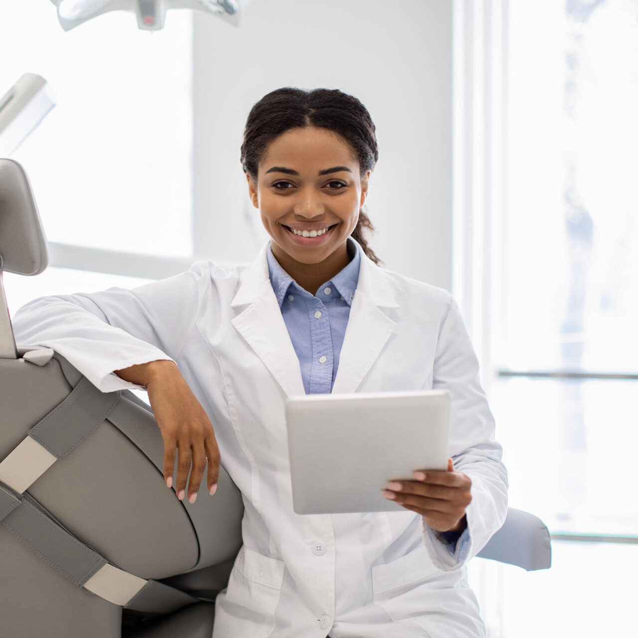 happy-black-dentist-female-with-digital-tablet-pos-2025-03-18-18-36-12-utc-e1753428327822.jpg